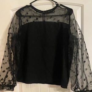 Black shirt with sheer sleeves